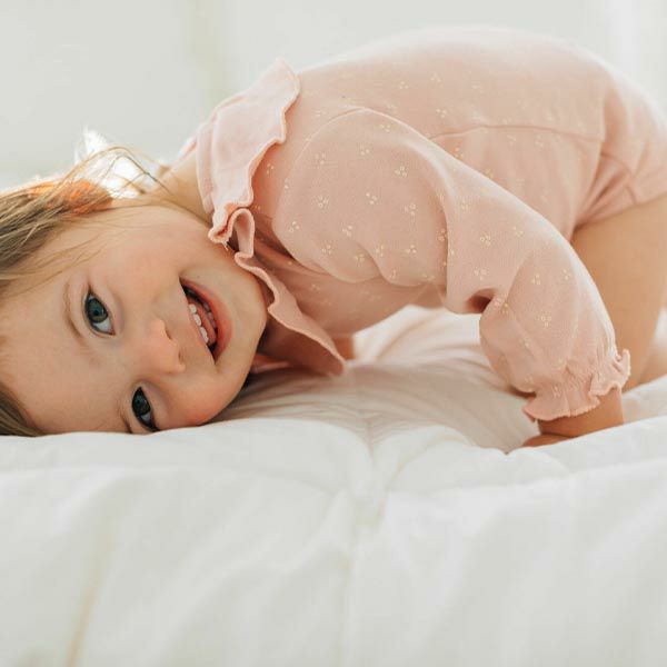 オーガニックコットン ベビーラッフルボディスーツ(長袖)